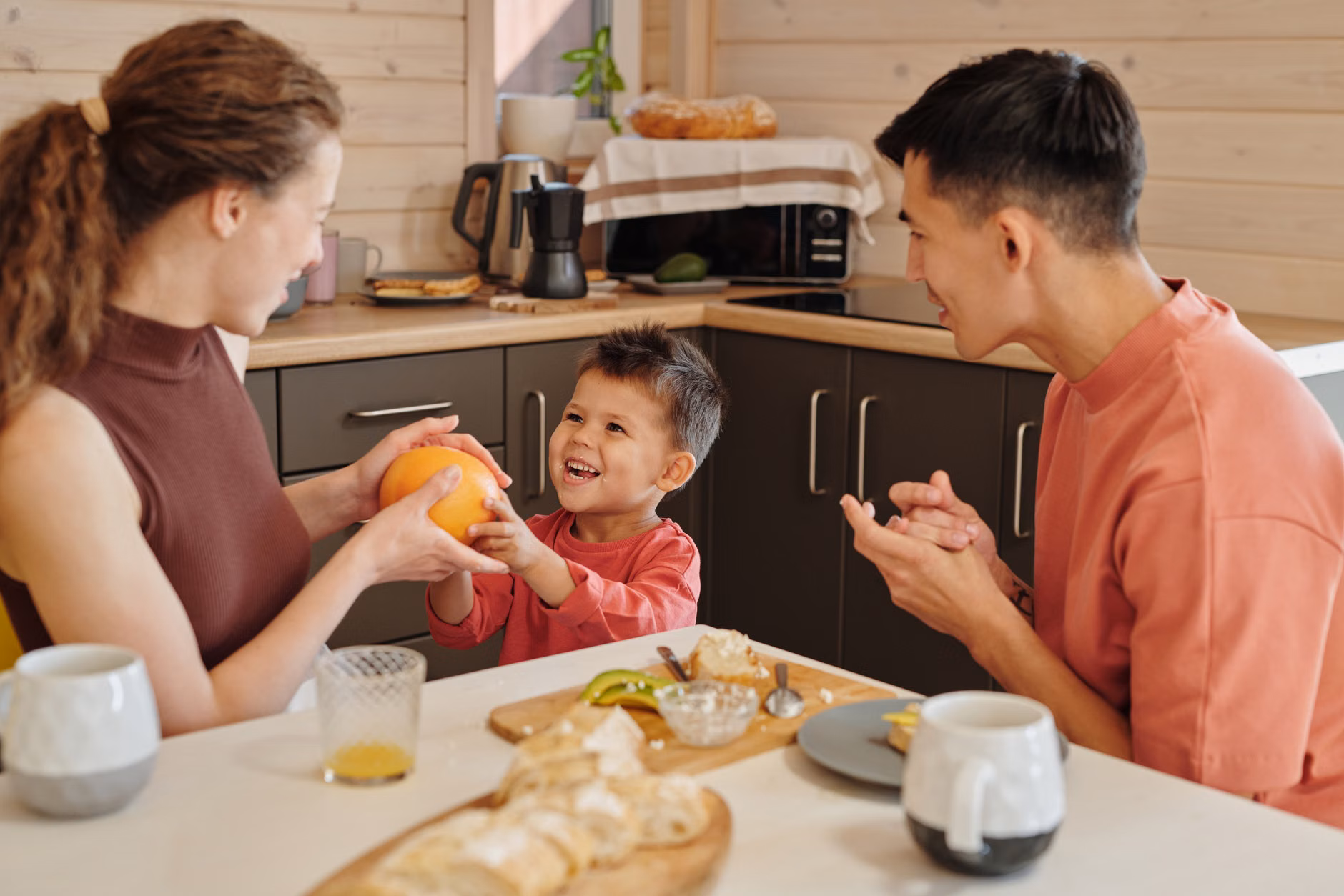 Parent and child practicing calm communication at the breakfast table.