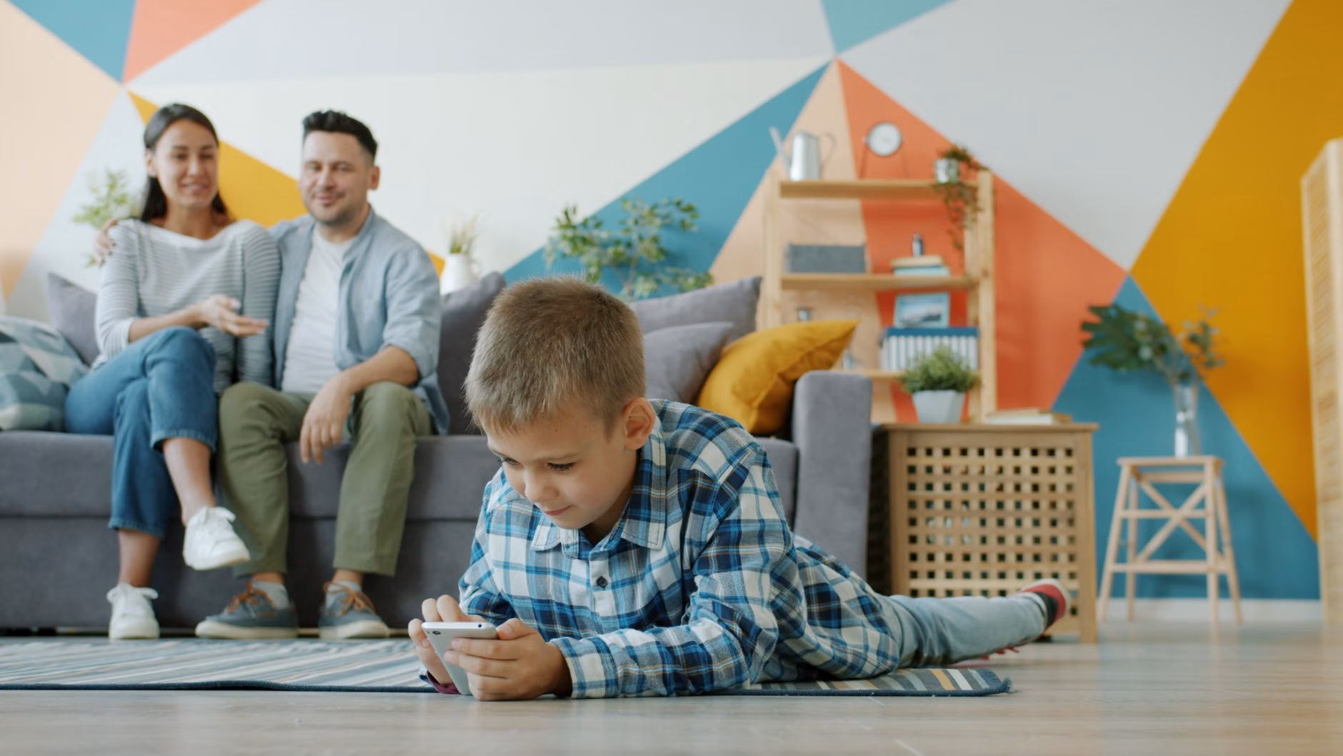 A parent relaxing away from their phone during family time.