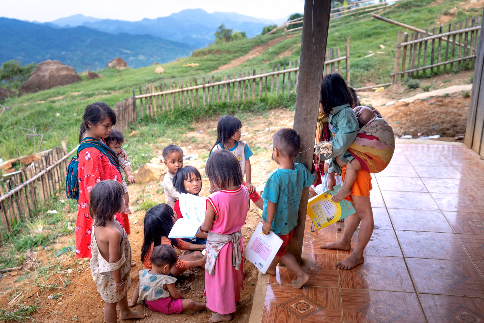 Parents and children gathering around a community book exchange.