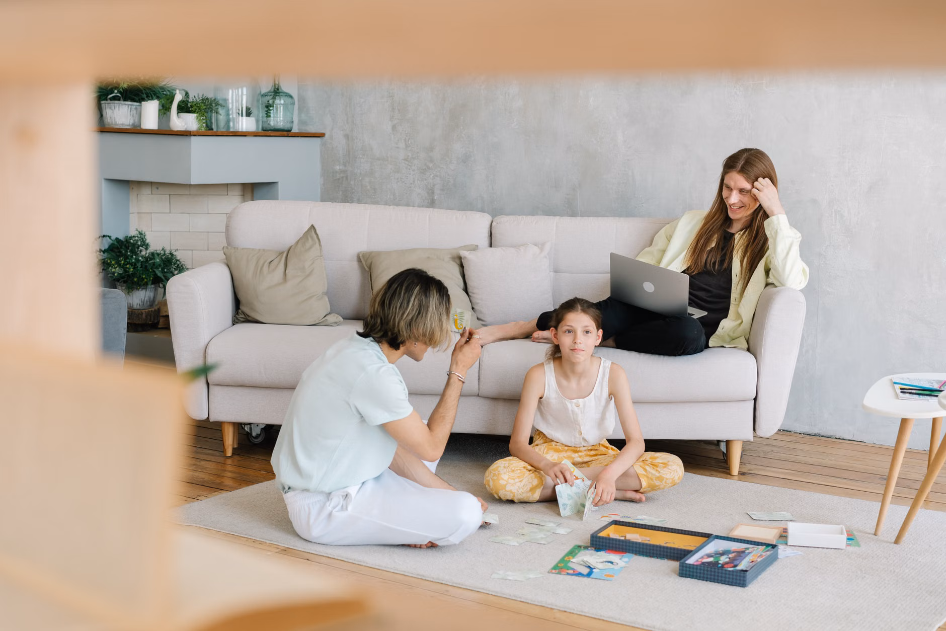 Parent and child playing a board game without digital distractions.