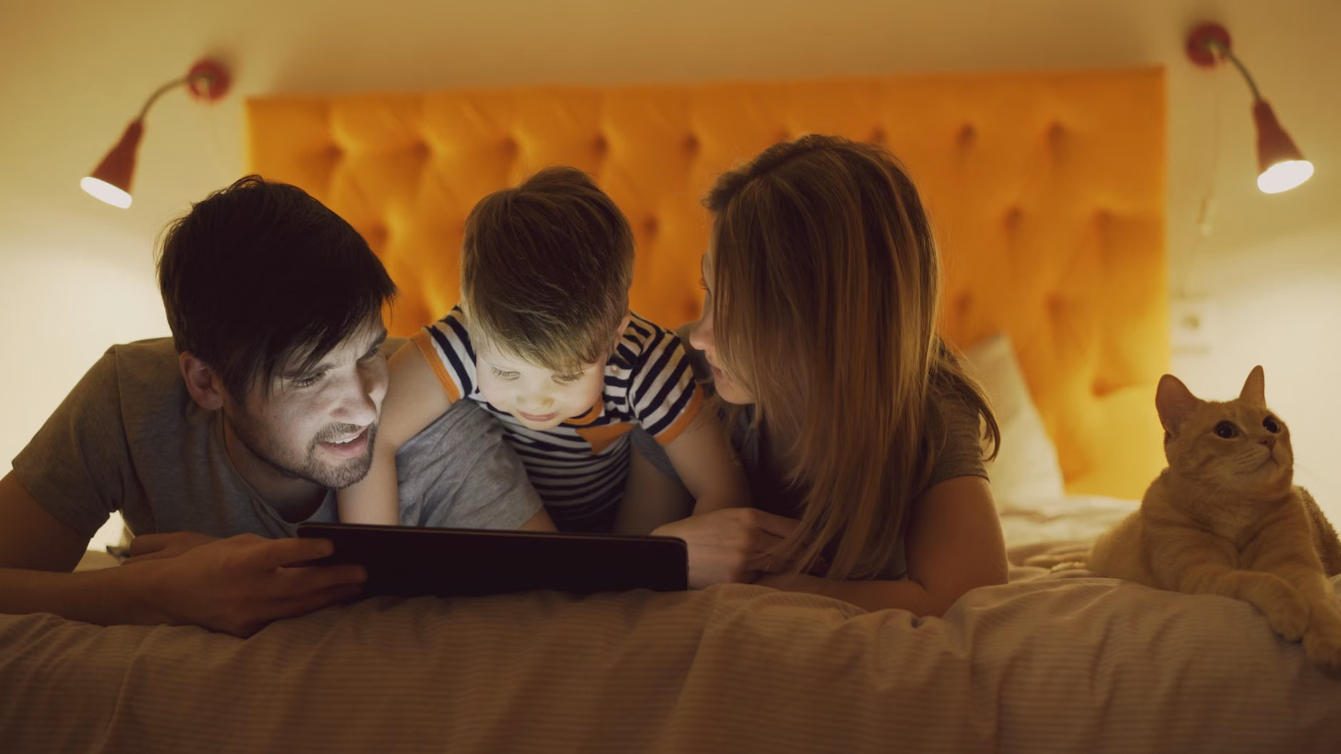 Family planning a staycation together on a tablet.