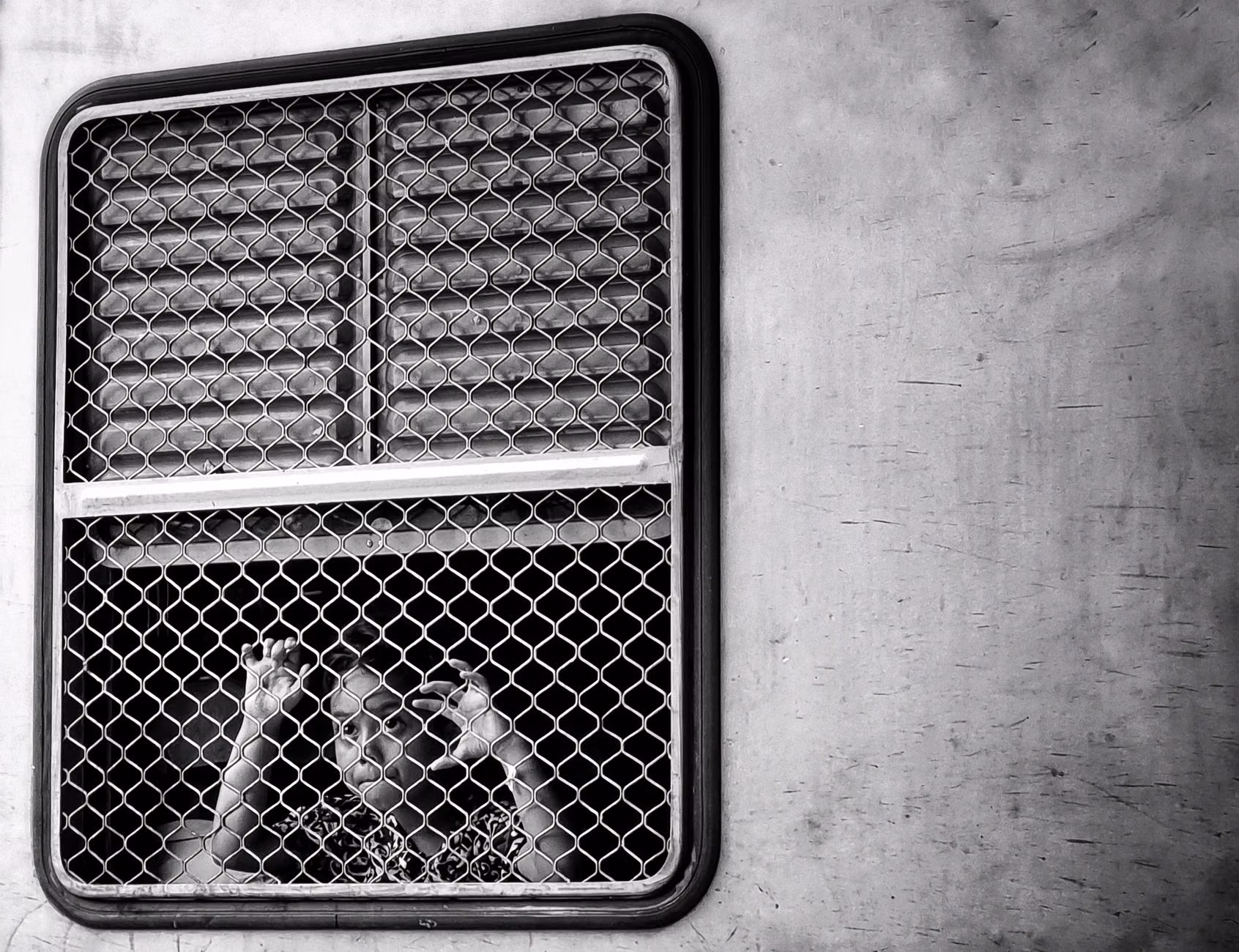 Parent and child looking out of a train window during a scenic journey.