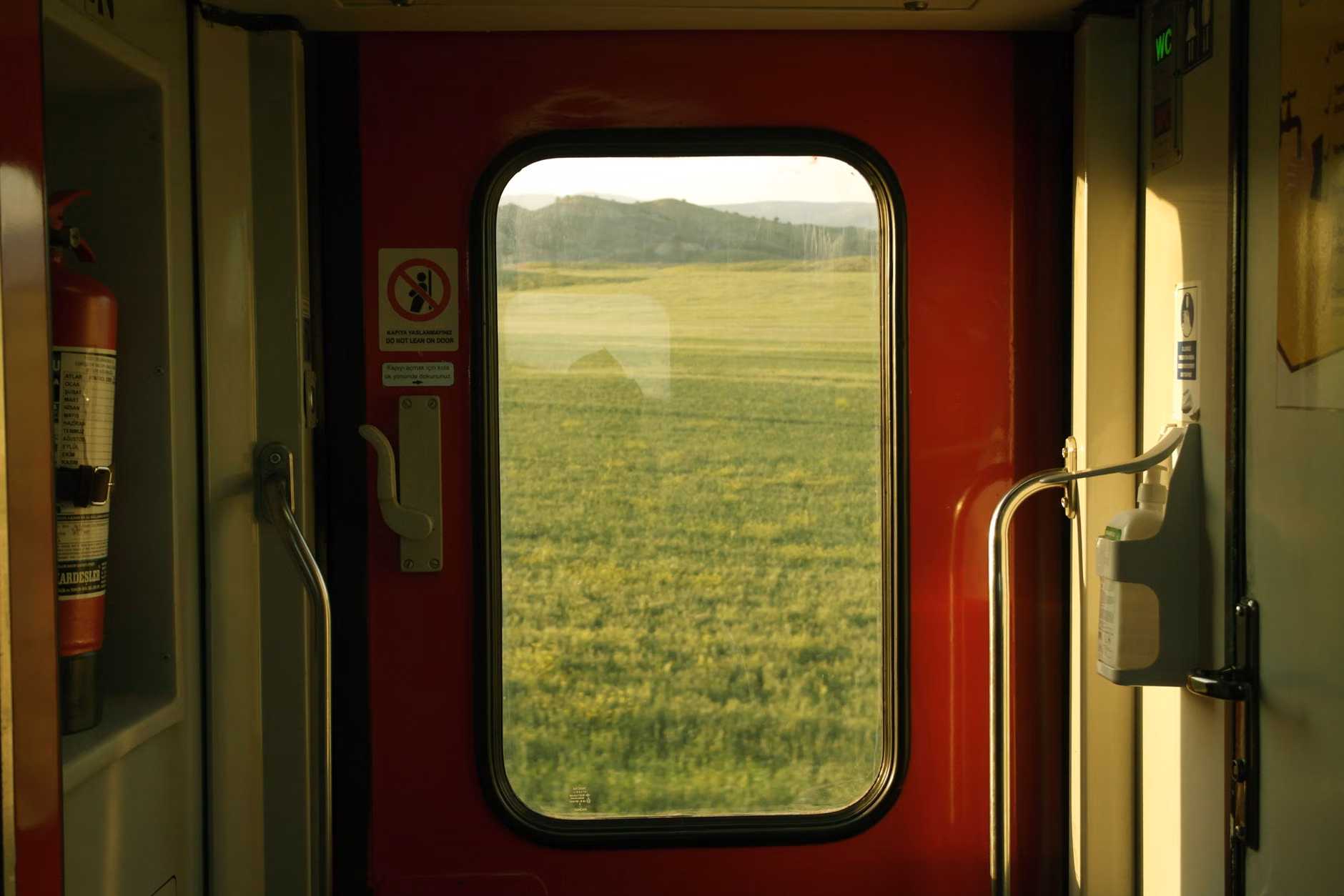 Family enjoying the view from a scenic train carriage window.