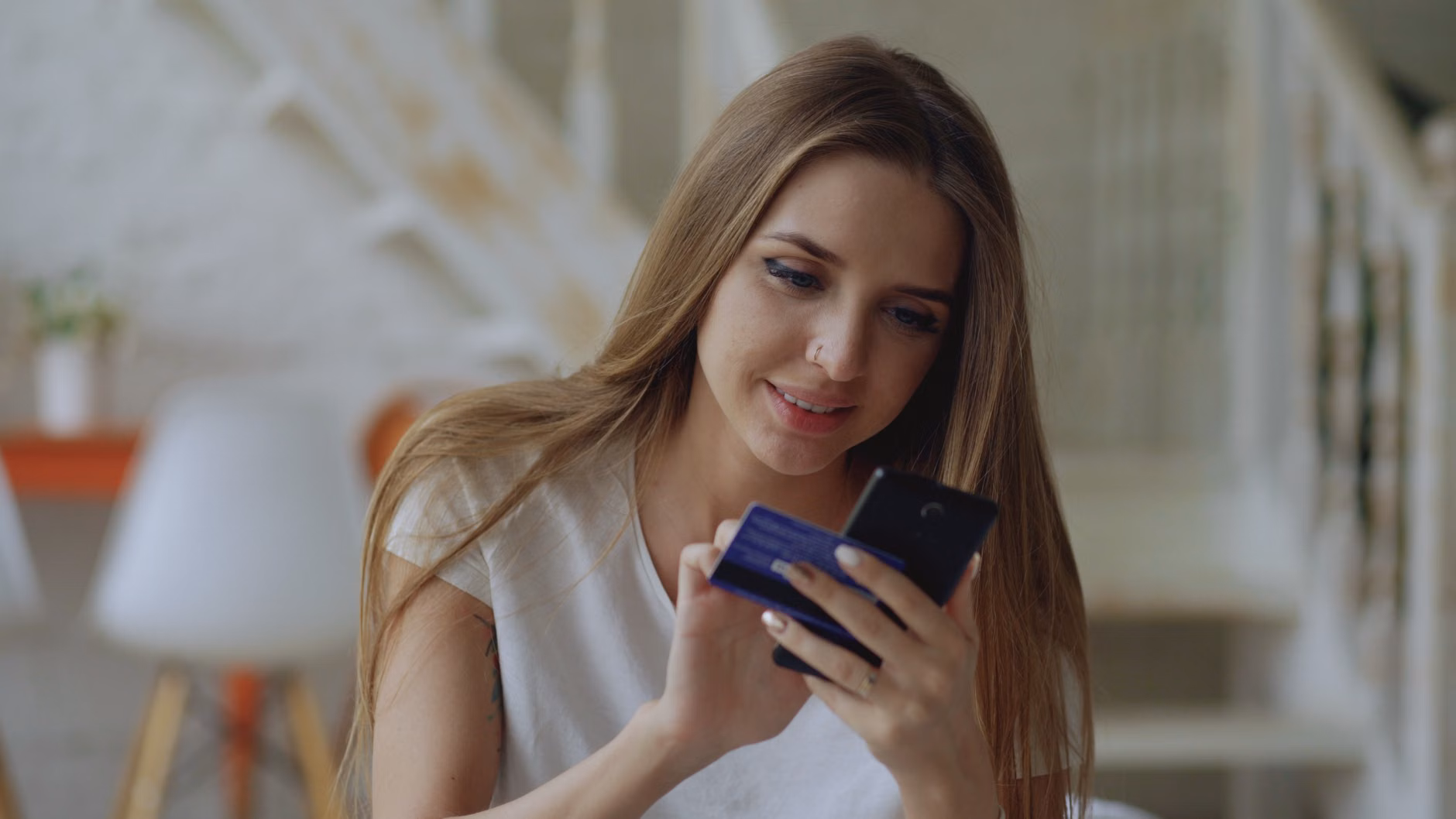 A teenager learning to use a mobile banking application.