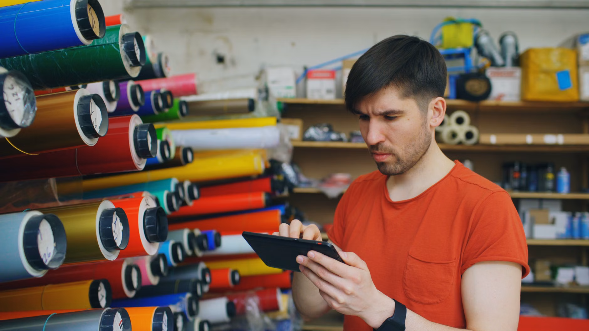 Person using a smartphone to manage home pantry inventory.