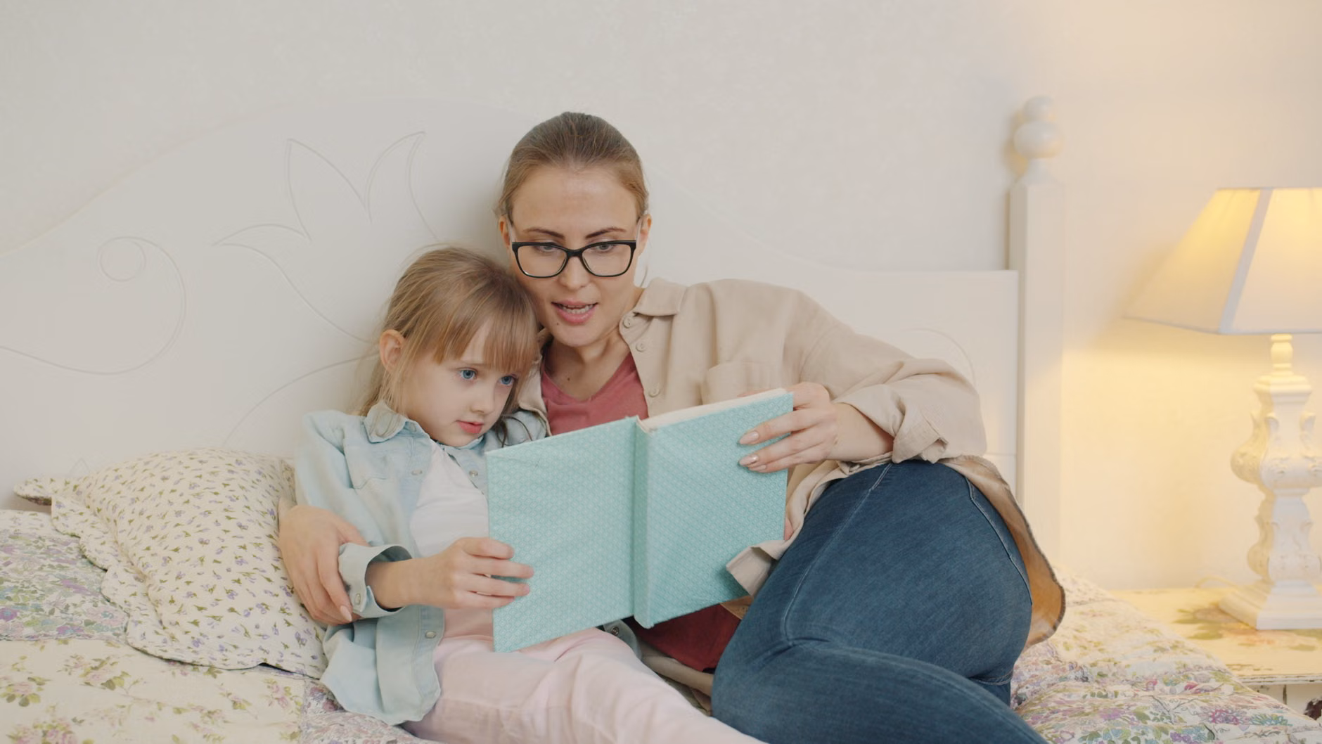 Parent and child reading a book about feelings together.