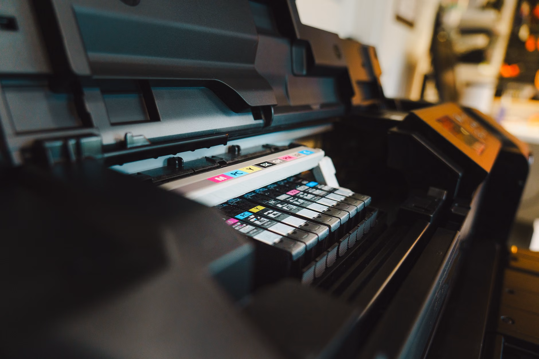 Inspecting printer ink cartridges for common clogging issues.