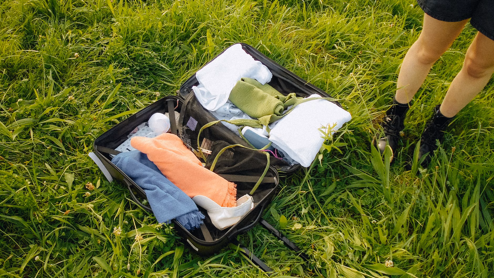 Essential travel gear for a family rail excursion arranged on a rustic table.