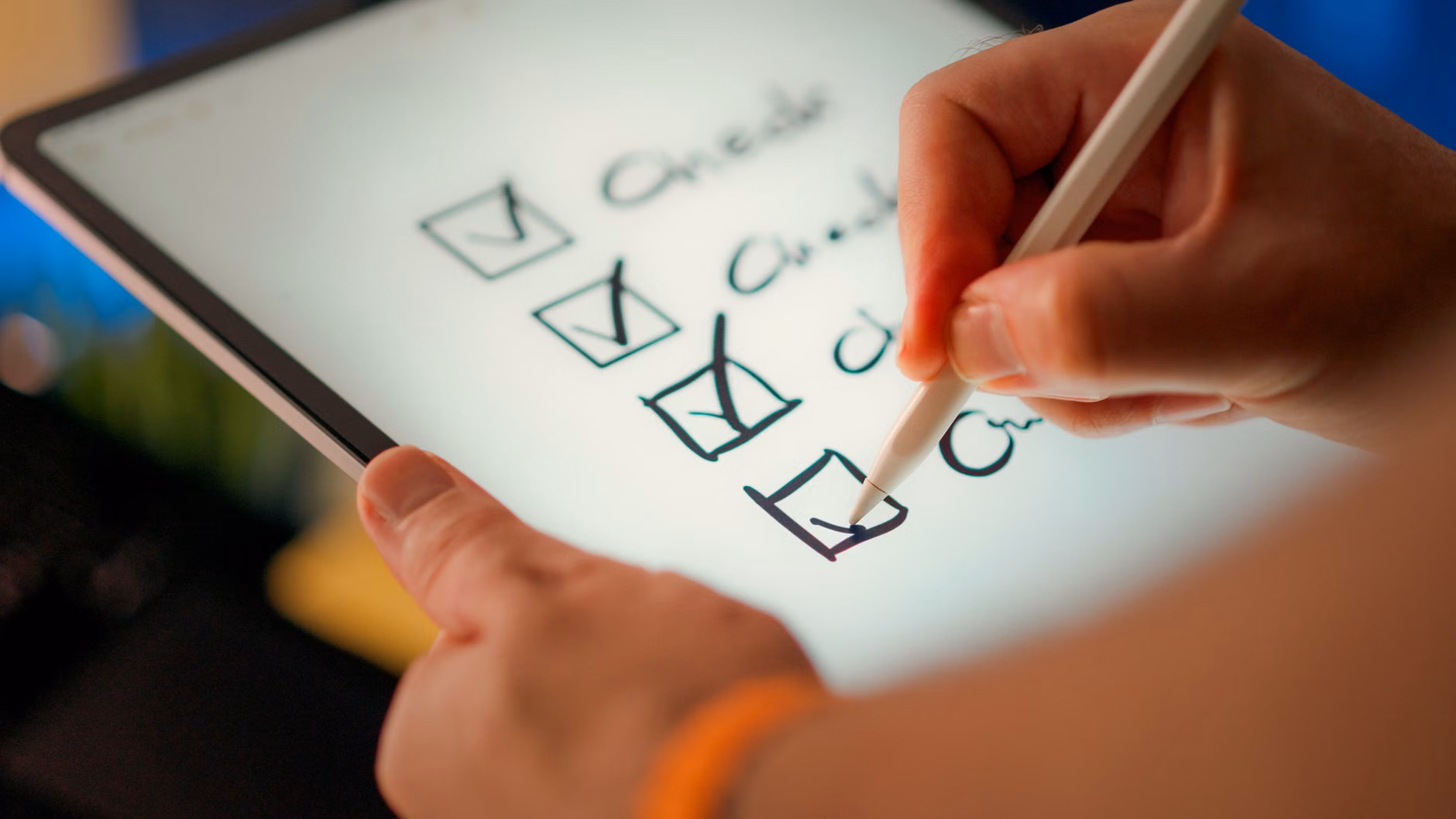 A parent managing household tasks on a tablet.