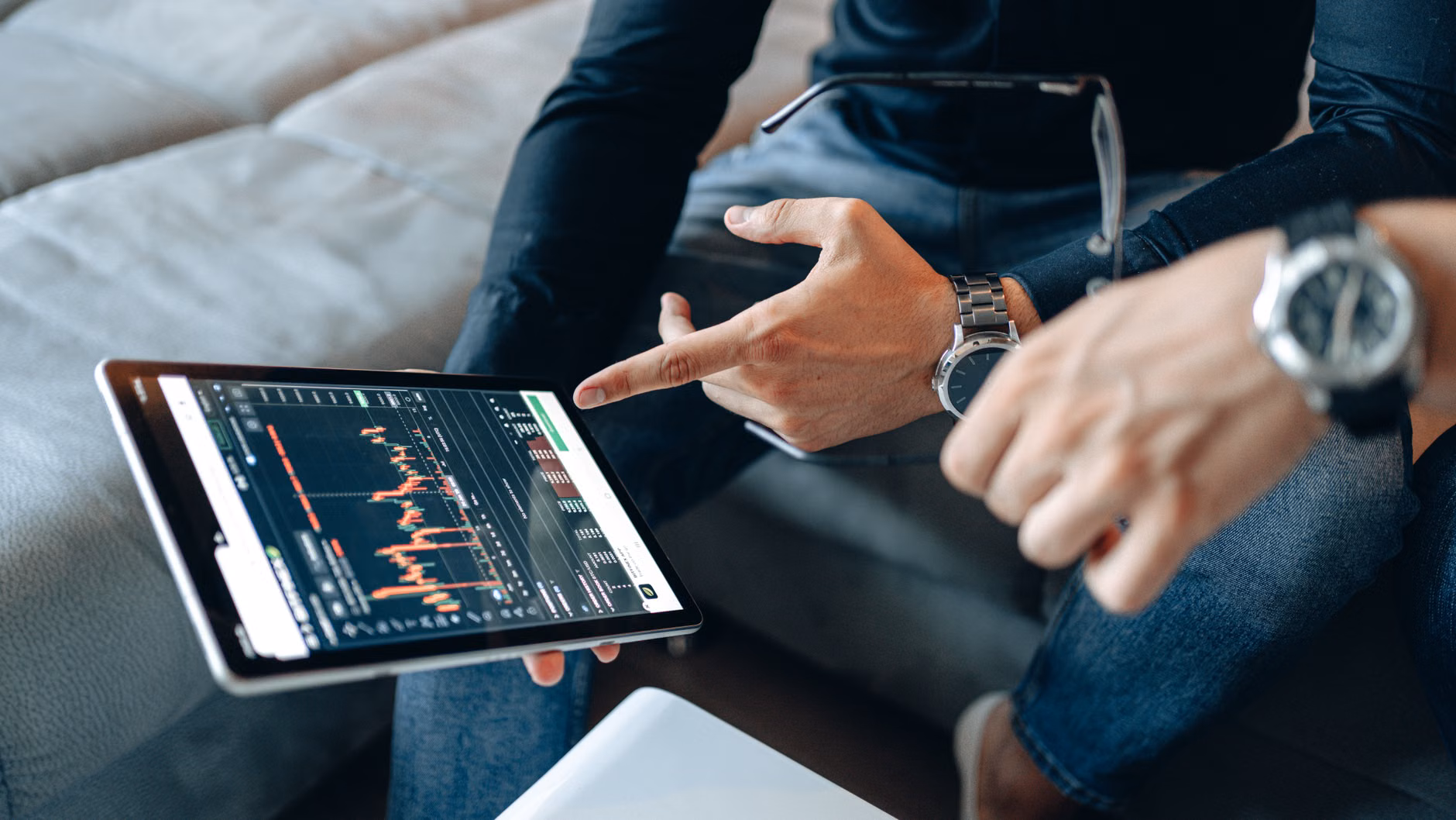 Person analyzing home energy data on a tablet