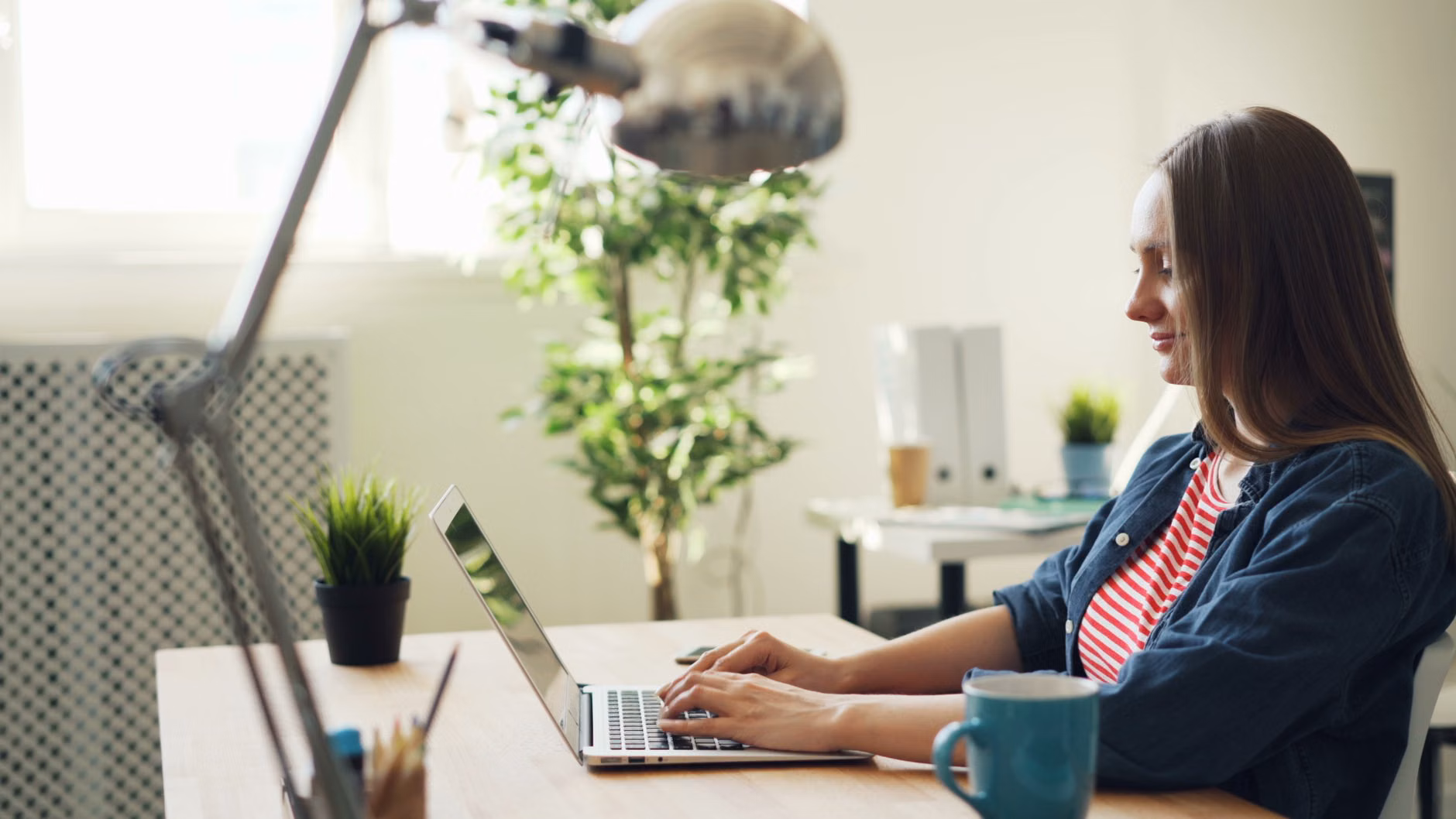 Remote professional working securely on a laptop in a home office.