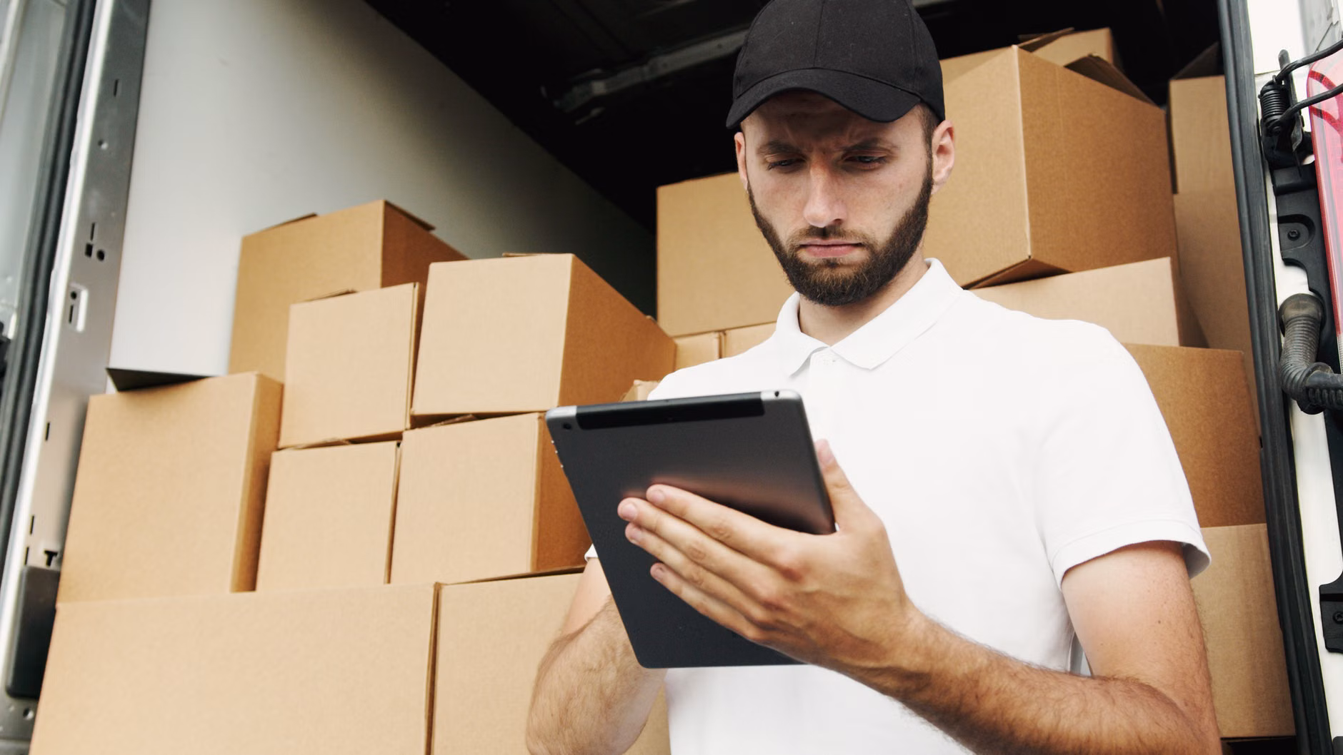 Using a tablet to track hardware inventory and maintenance schedules.