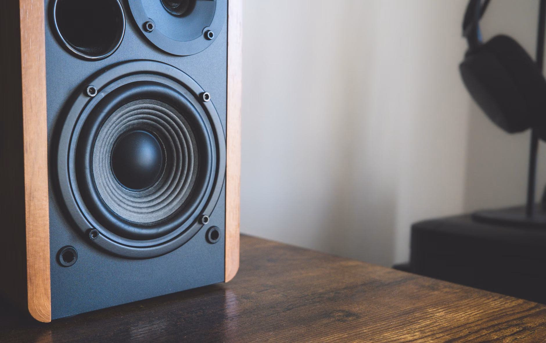 A close-up view of a minimalist desk setup featuring acoustic panels to minimize sensory distractions.