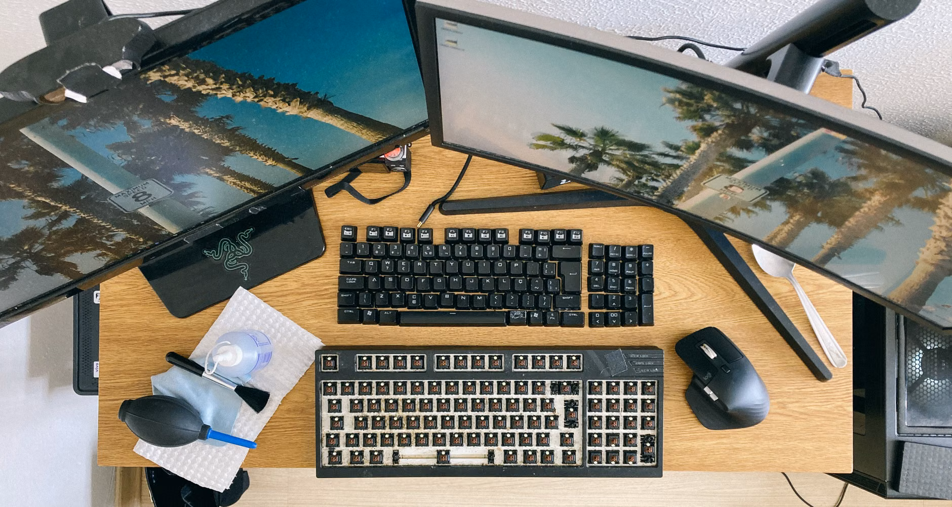 Top-down view of a multi-user modular desk with tech accessories.