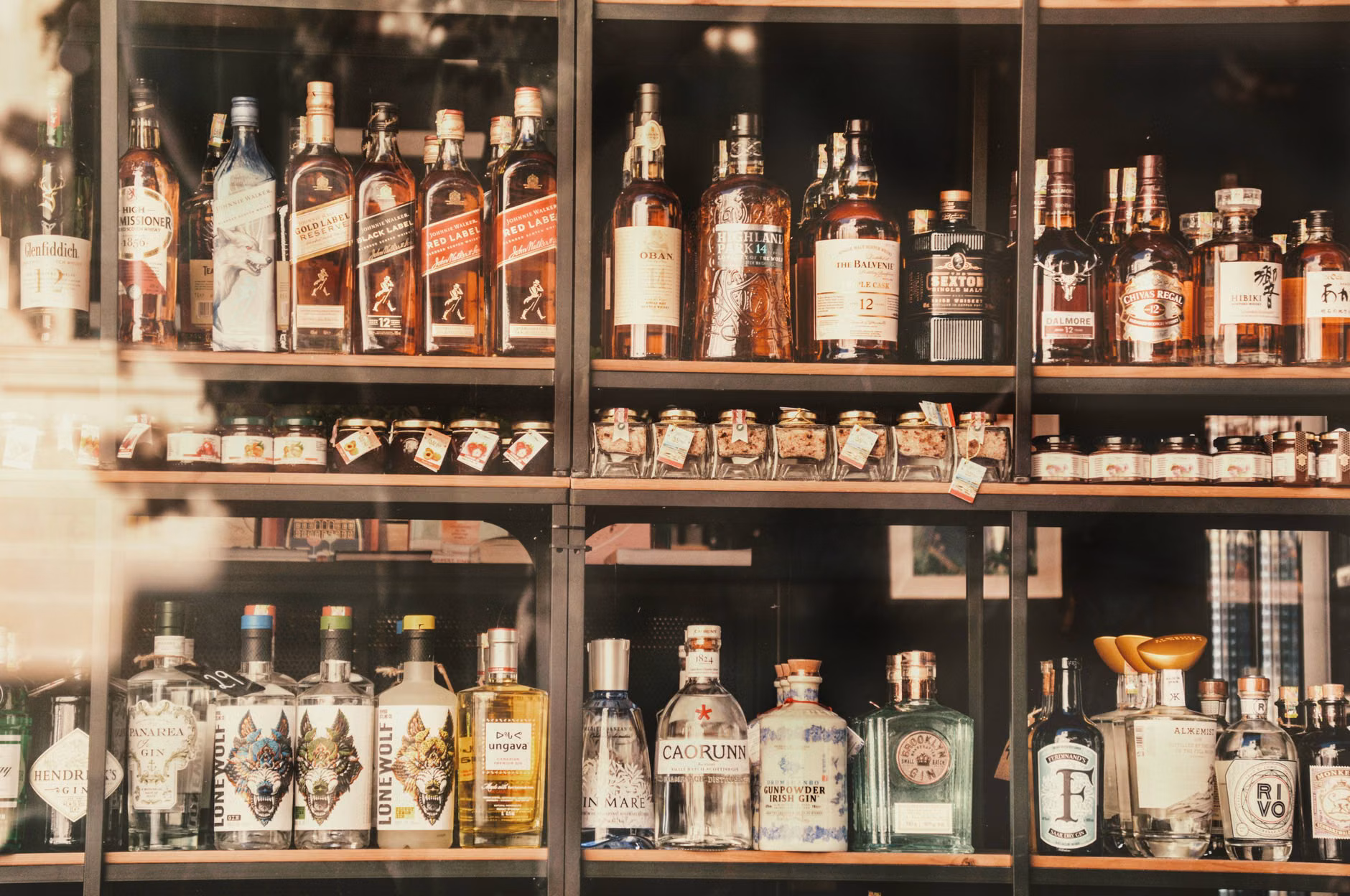 A variety of premium non-alcoholic spirit alternatives on a store shelf.