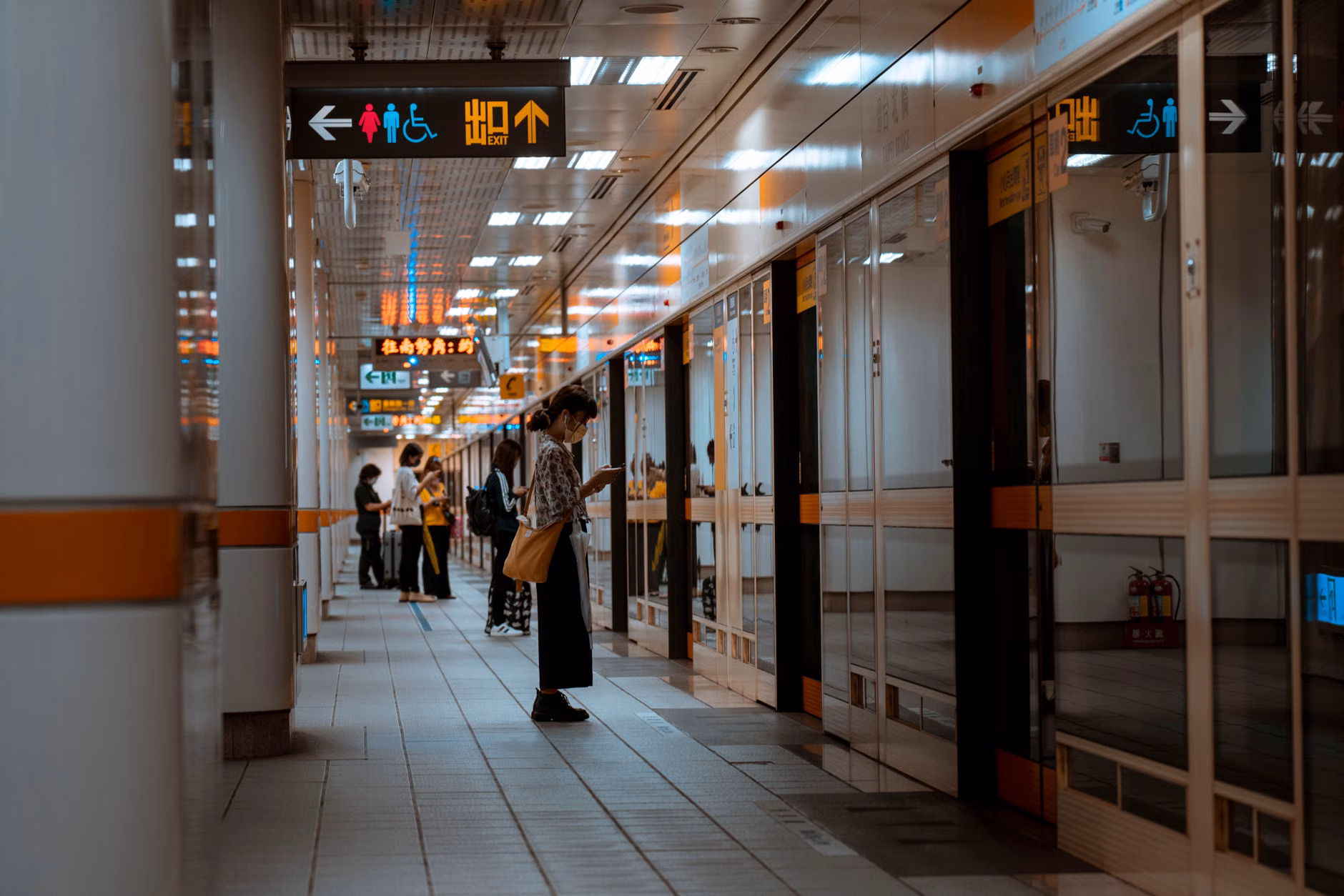 A family navigating a train station during their travel.