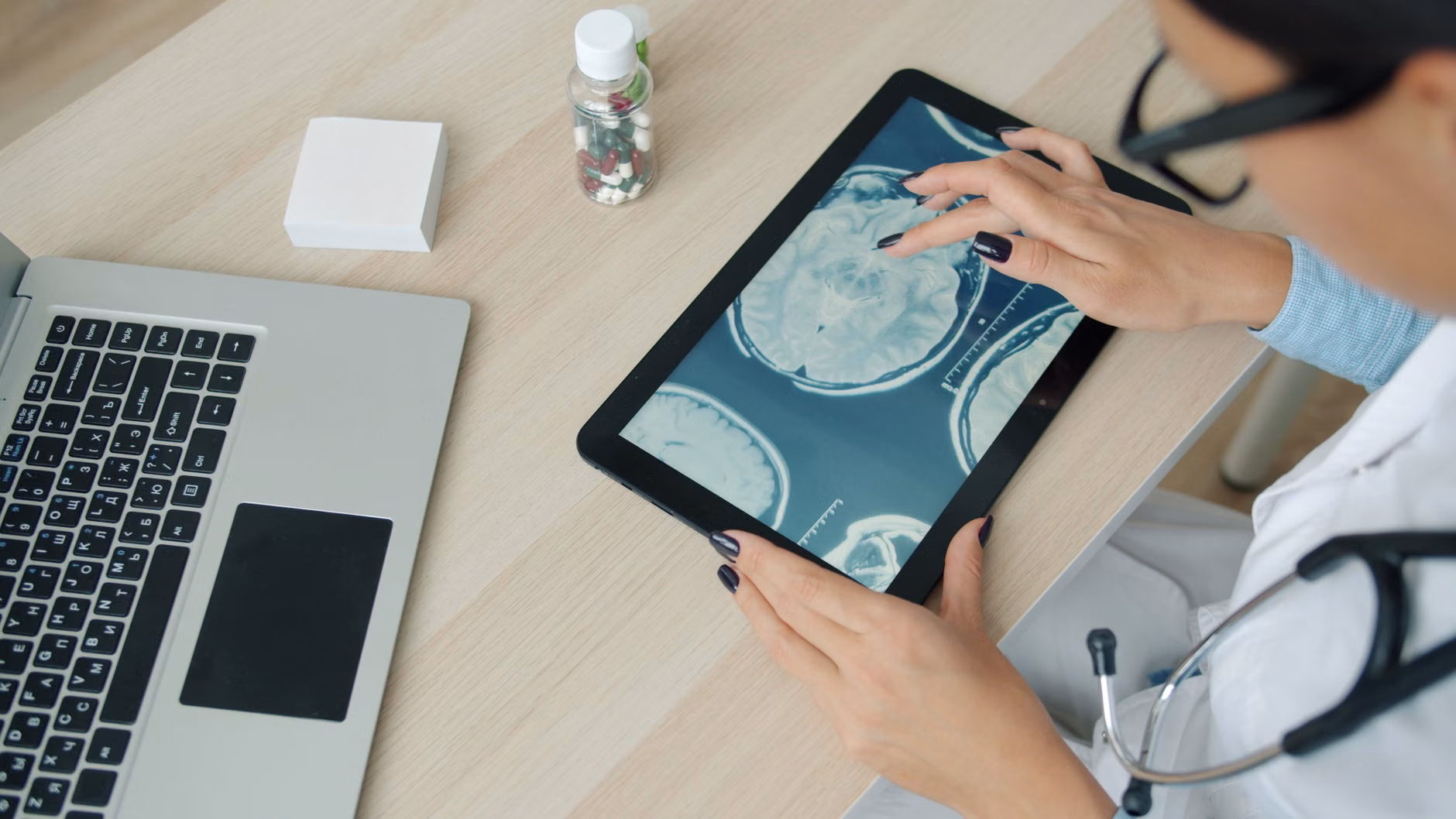 Teenager scanning an old photograph with a tablet