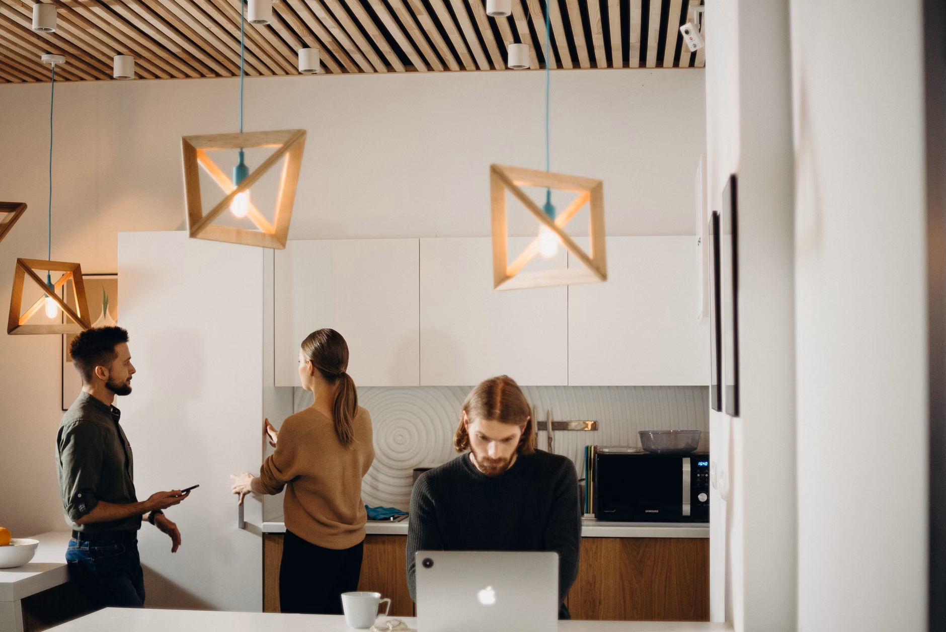 A communal kitchen area in a coworking hub fostering social connection.