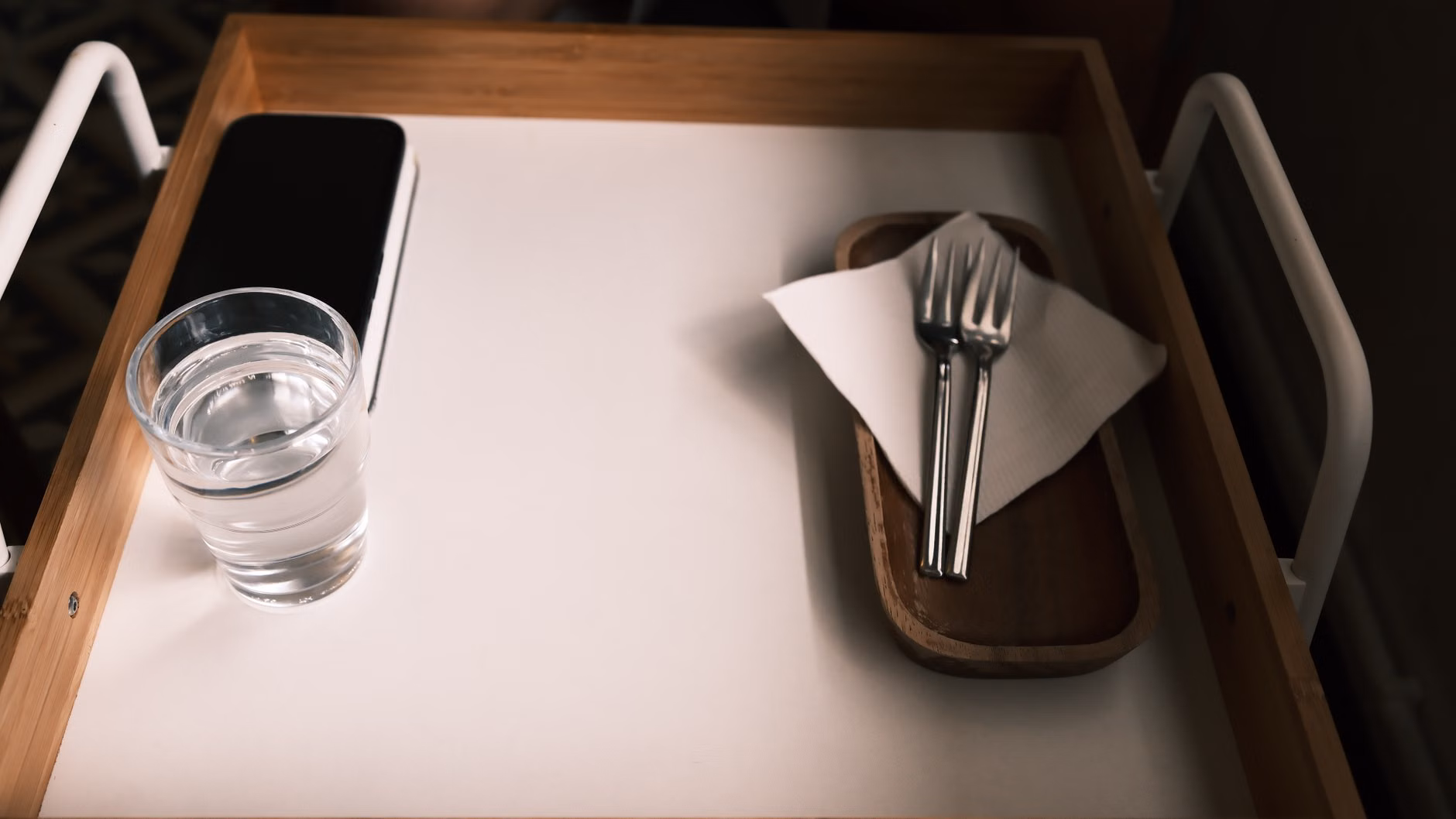 A pre-prepared simple breakfast tray on a kitchen table.