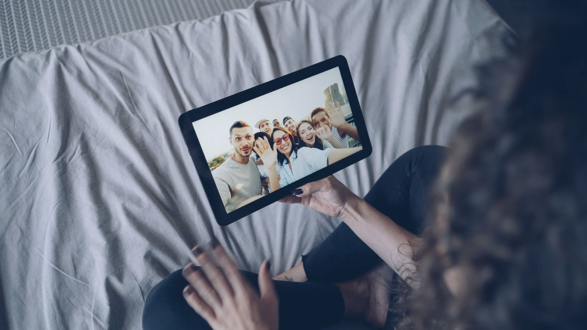 Family viewing digital photos on a tablet