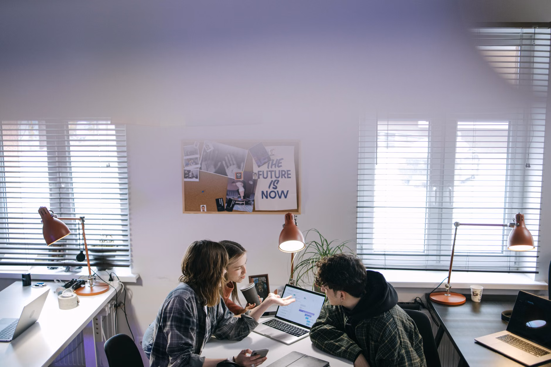 Colleagues discussing work hours in an office