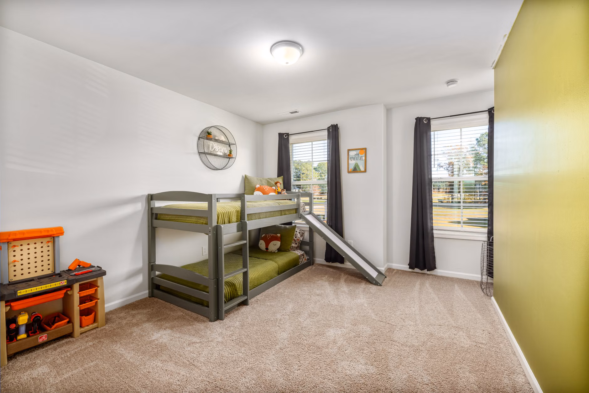 A child's bedroom featuring organized storage and neutral-toned toys.