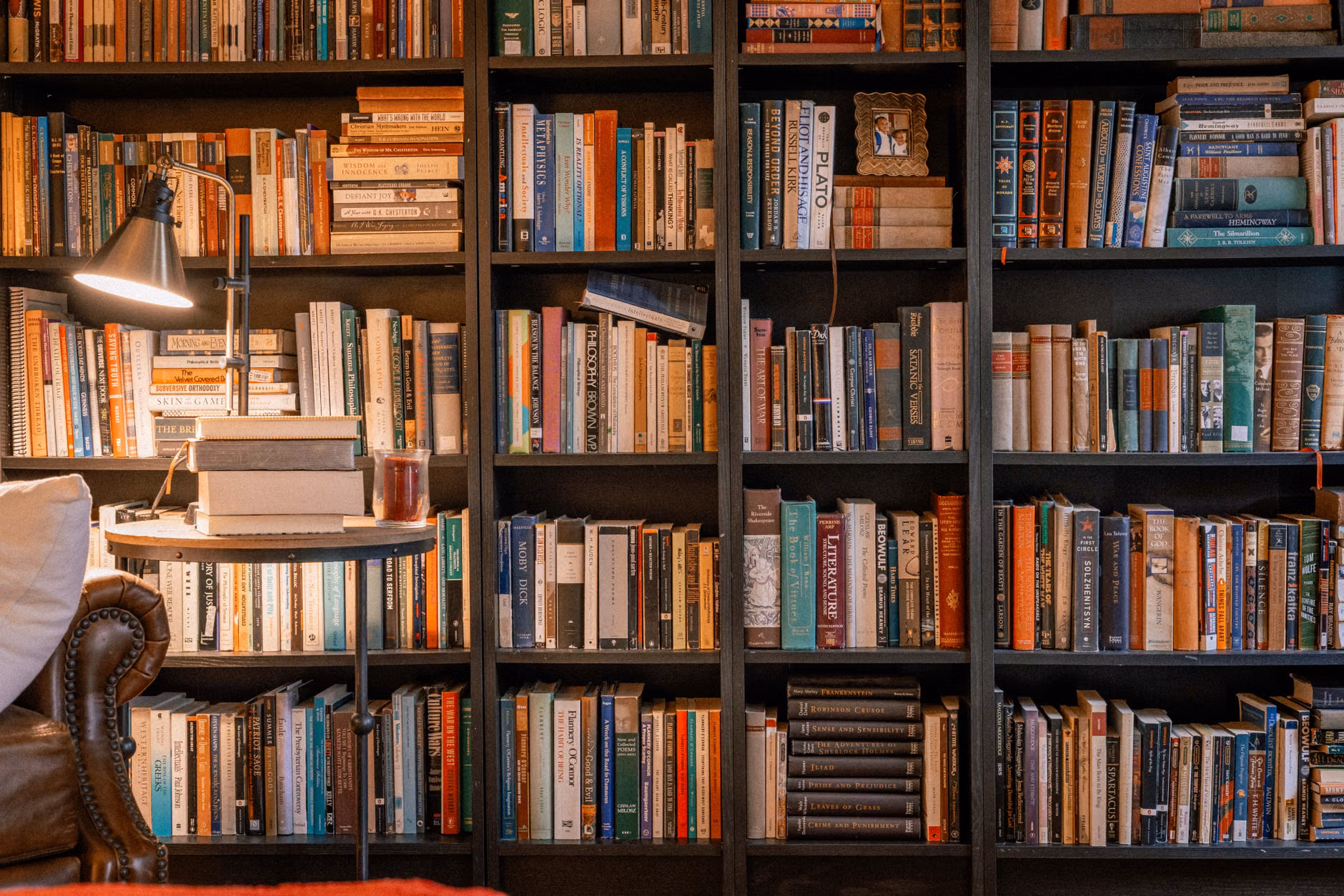 A quiet, cozy reading nook in a home library.