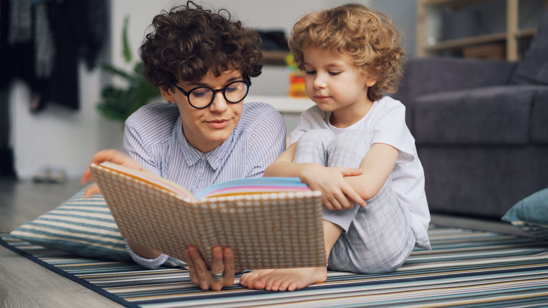 Parent and child reading a book about feelings.