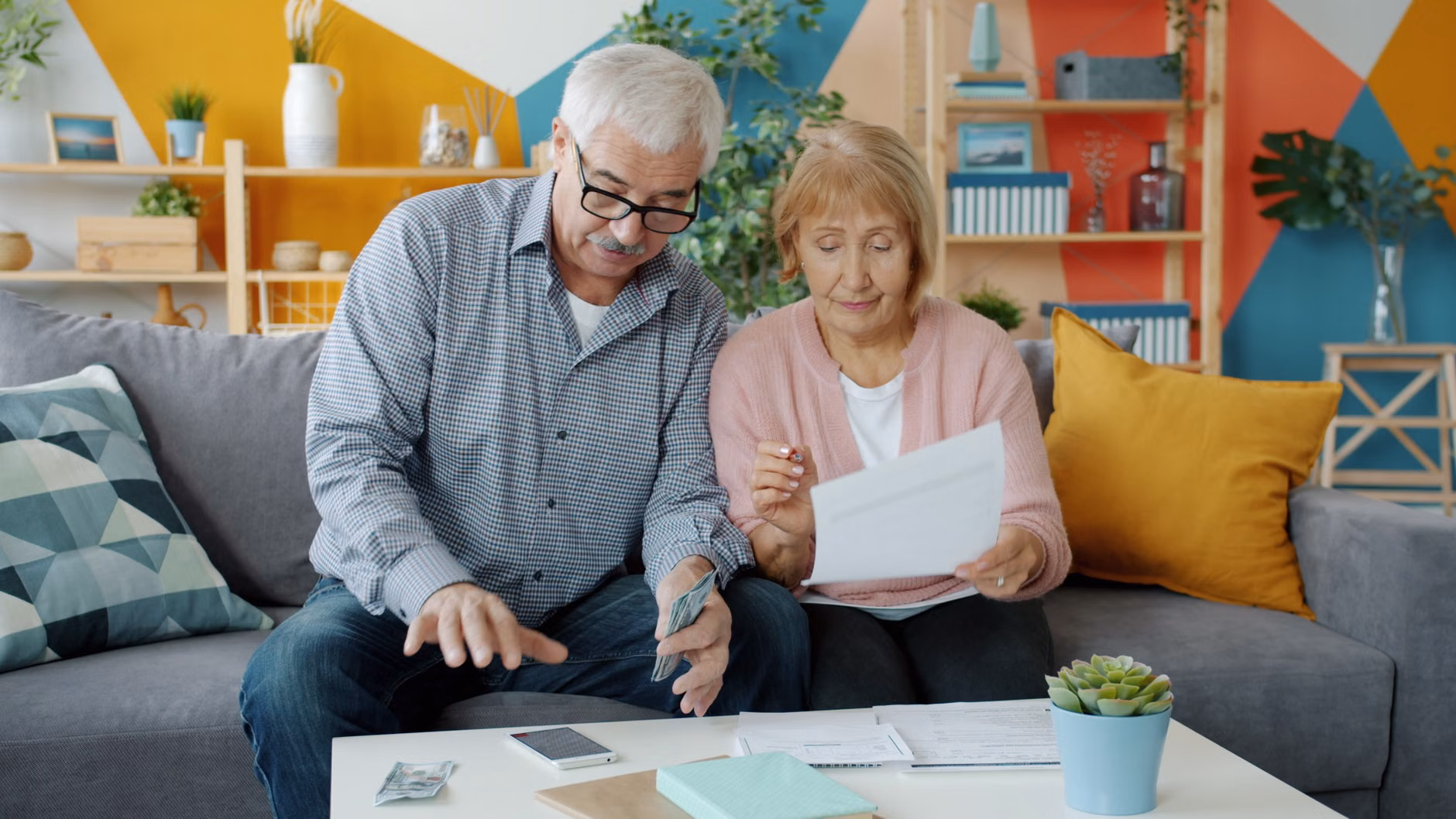 A family reviewing their household energy budget on a tablet.