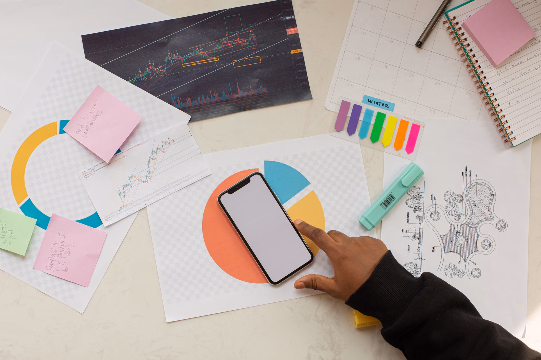 A mix of digital and physical organizational tools on a family kitchen counter.