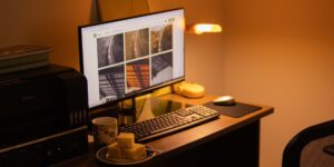 A home office setup showing a printer being maintained with simple tools.