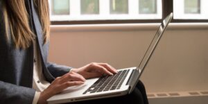 A professional working in a home office environment, balancing career and life.