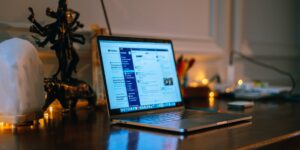 A closed laptop on a desk at night representing the right to disconnect.