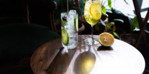 Elegant table setting with non-alcoholic botanical drinks for a sophisticated gathering.