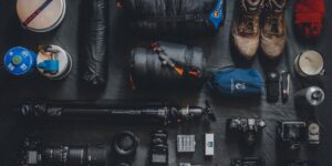 A flat-lay photography of travel essentials for a family trip.
