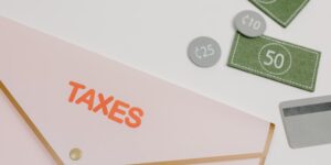 A conceptual image representing the financial impact of carbon taxes on household planning.