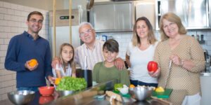 A modern multi-generational kitchen with accessible features and warm lighting.