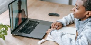 A child engaging with digital learning tools in a bright, modern home setting.