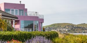 A scenic view of a modern vacation home in a mountainous landscape.