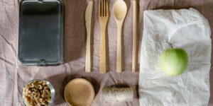 An organized kitchen counter with lunchbox components laid out for efficient packing.