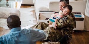 A parent and toddler sharing a calm moment in a sunlit living room.