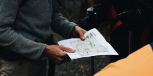 A family planning their route on a mountain trail using modern technology.