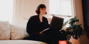 A professional working remotely in a bright, modern home office setup.
