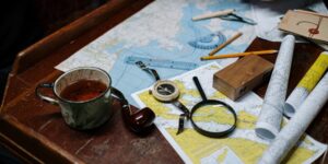 Traveler planning a heritage trip with maps and digital tools
