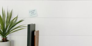 A clean, modern family planning space with a calendar and digital device on a wooden table.