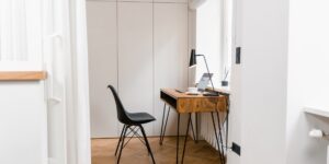 A professional and serene remote work setup near a bright window.