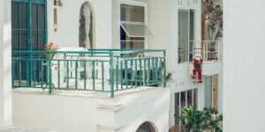 A cozy, well-designed urban balcony with plants and a play area for children.