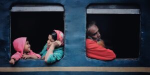 A family enjoying a scenic train ride together.