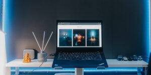 Modern home office setup with laptop and smartphone representing tech consumption.