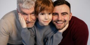 Three generations of a family planning a trip together using a tablet.